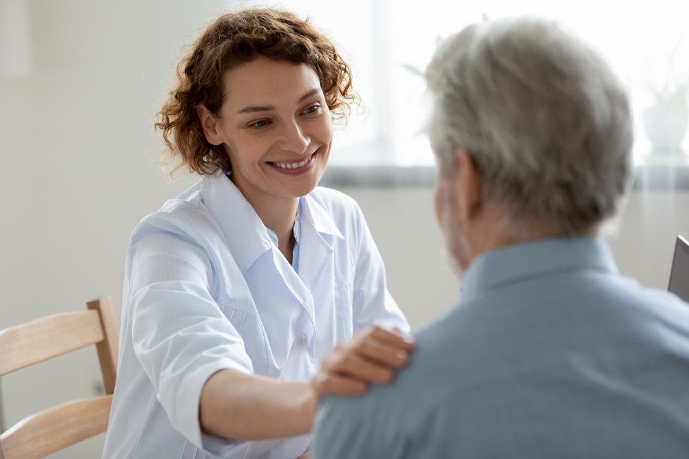 Social worker supporting elderly patient